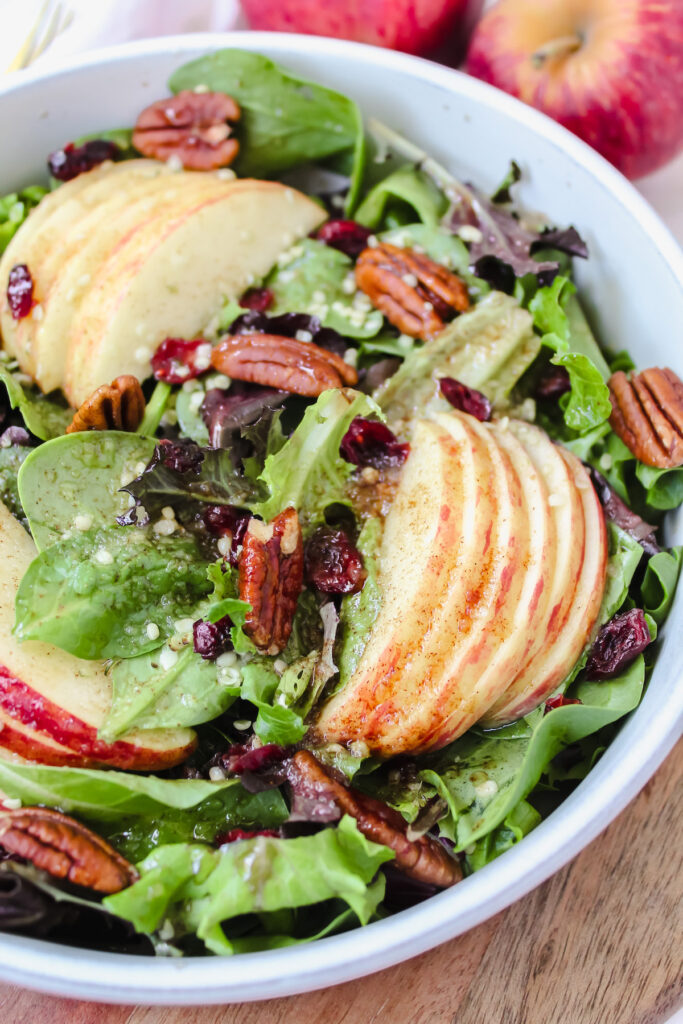 3/4 of the apple cinnamon salad shown in the bowl