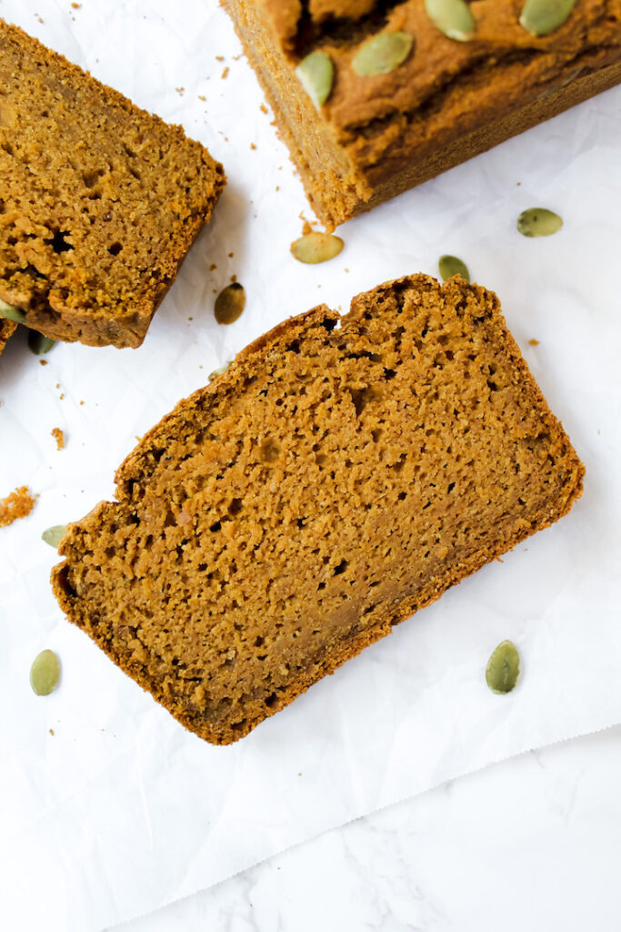 close up shot of one slice of the best healthy pumpkin bread