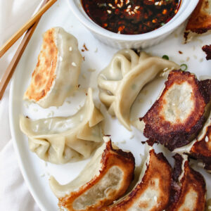 photo of potstickers and soy sauce