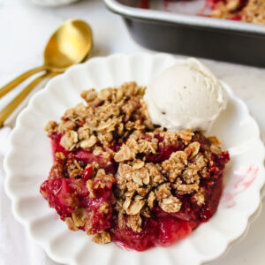 close up of strawberry crisp with ice cream