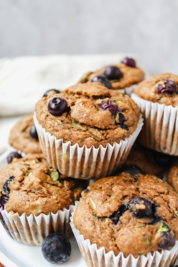 side angle shot of muffins stacked in a pyramid