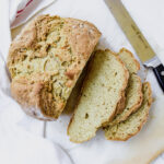 overview shot of Irish soda bread with sliced pieces on the side