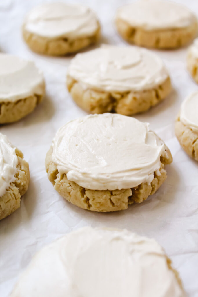 angled shot of plain sugar cookie with frosting