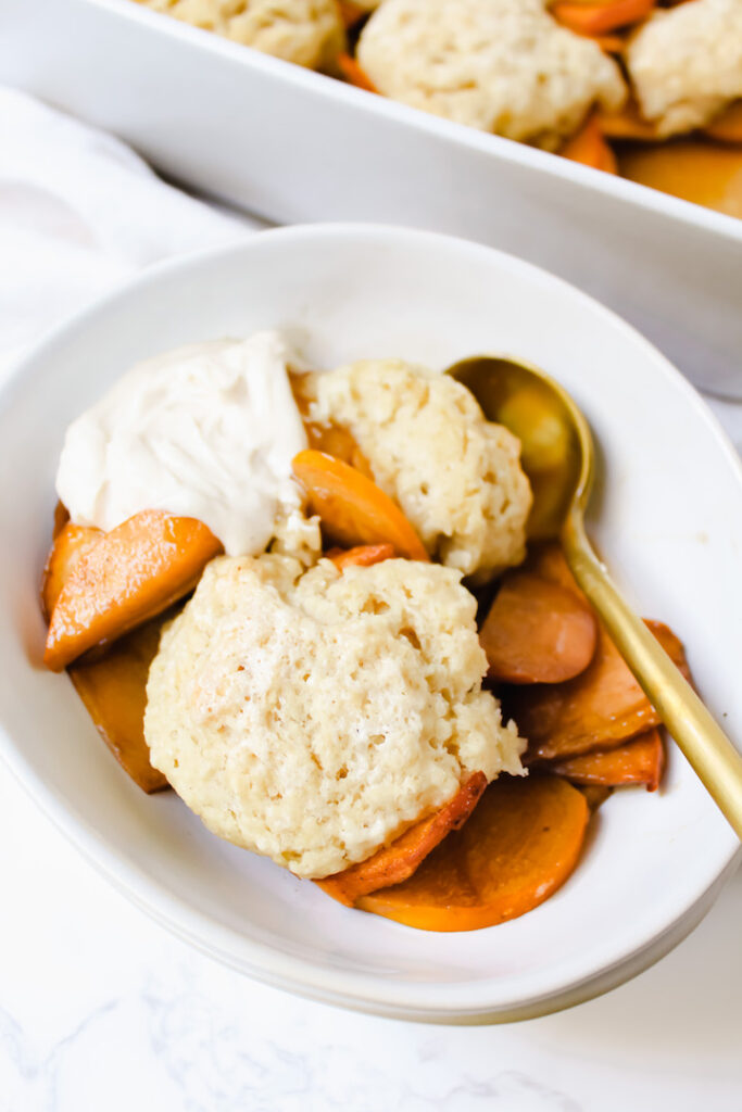 shot of a bowl of vegan cardamom persimmon cobbler