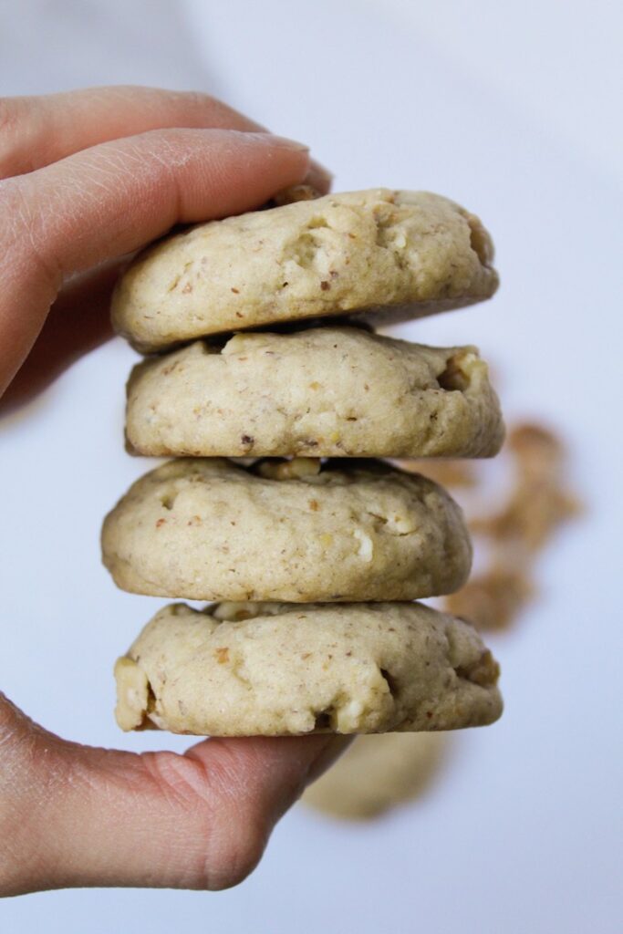 hand holding a stack of cookies