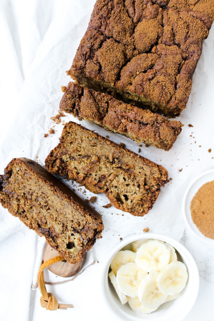 overview shot of the best cinnamon swirl banana bread with 3 slices cut