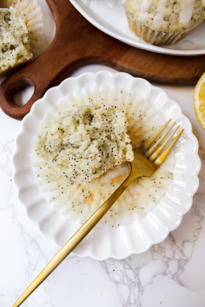 inside half of the muffin on a plate with a fork