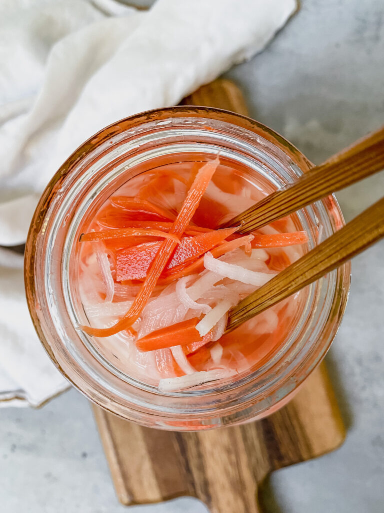 close up shot of pickled daikon and carrots