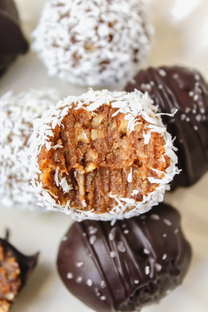 bite shot of a coconut covered truffle