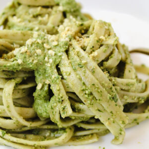 angled shot of pesto pasta twirled