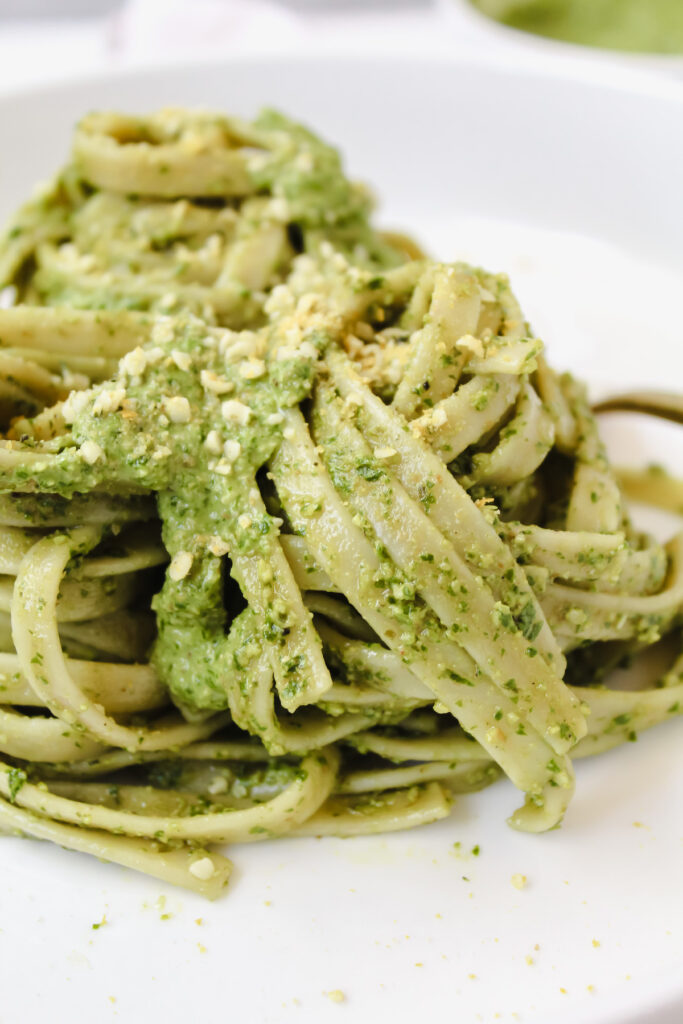 angled shot of pesto pasta twirled