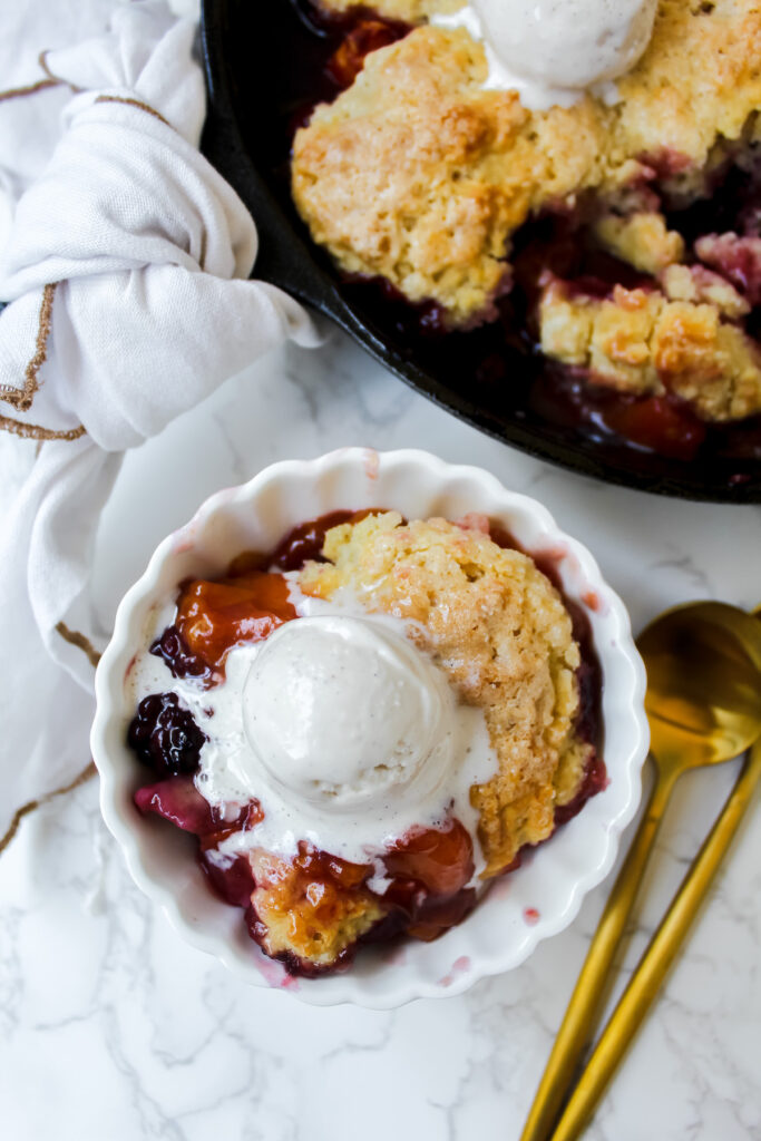 overview shot of cobbler in the pan and in a bowl