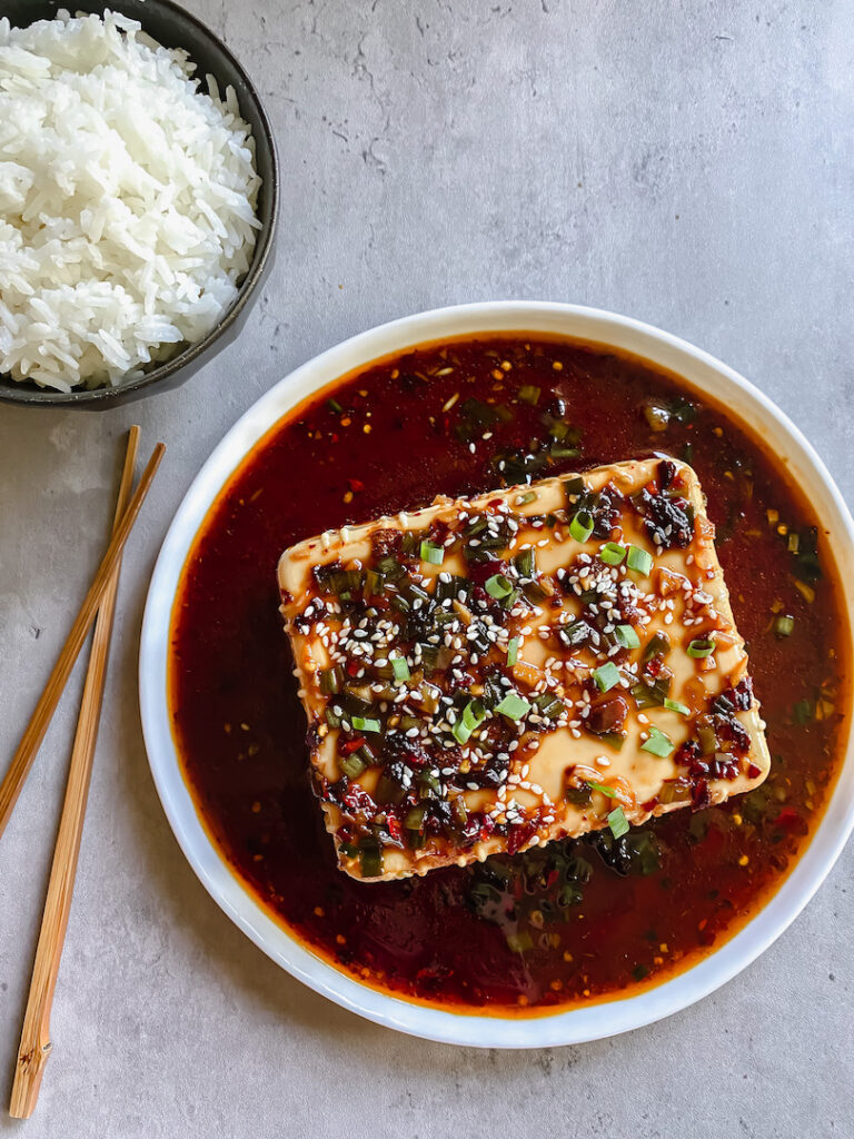 picture of silken tofu and rice with chopsticks on the side