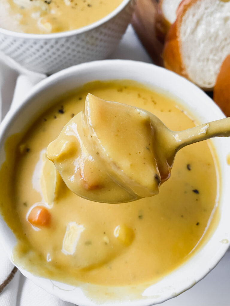 Close up of a spoonful of the potato soup