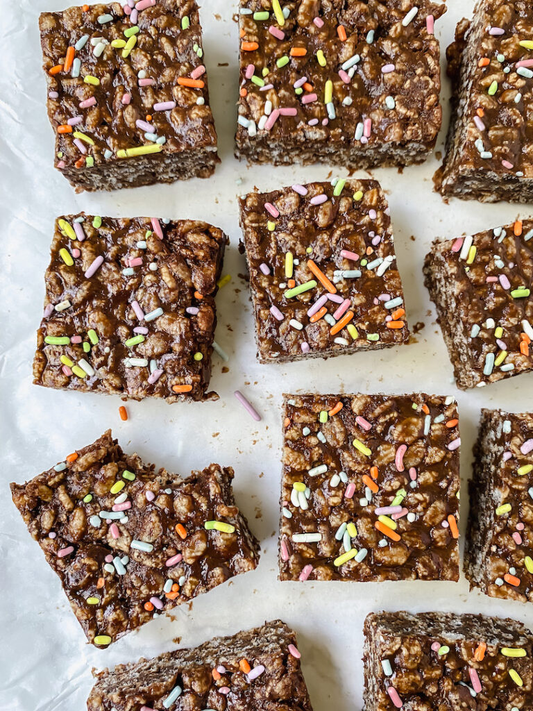 overview shot of chocolate protein rice crispy treats with a bite taken out