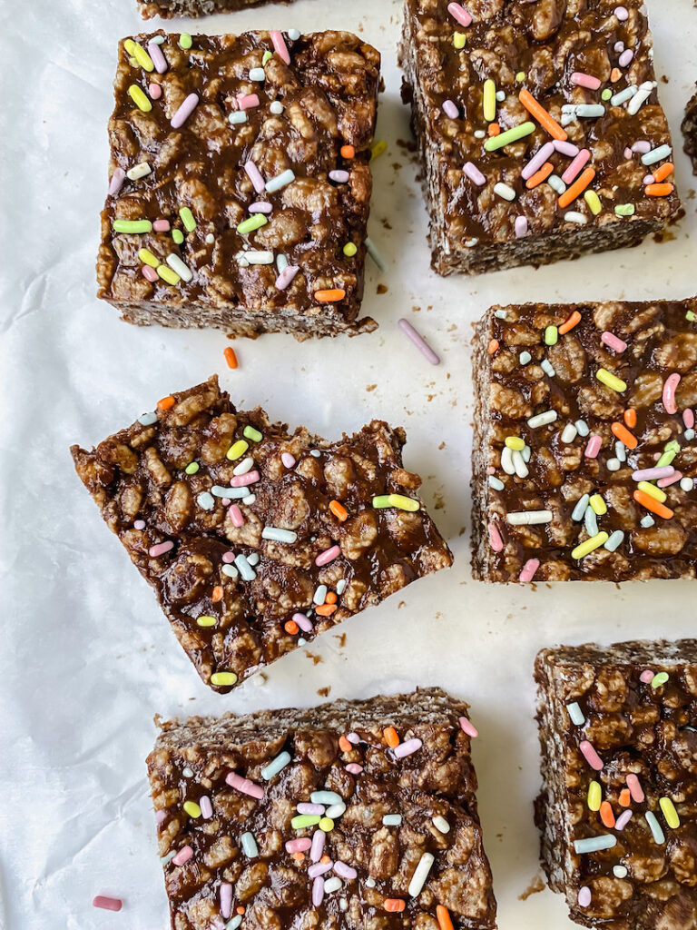 overview shot of chocolate protein rice crispy treats with a bite taken out