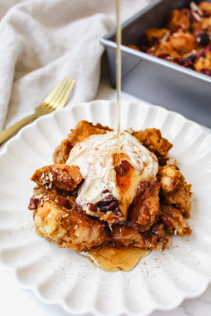 maple syrup being poured onto french toast