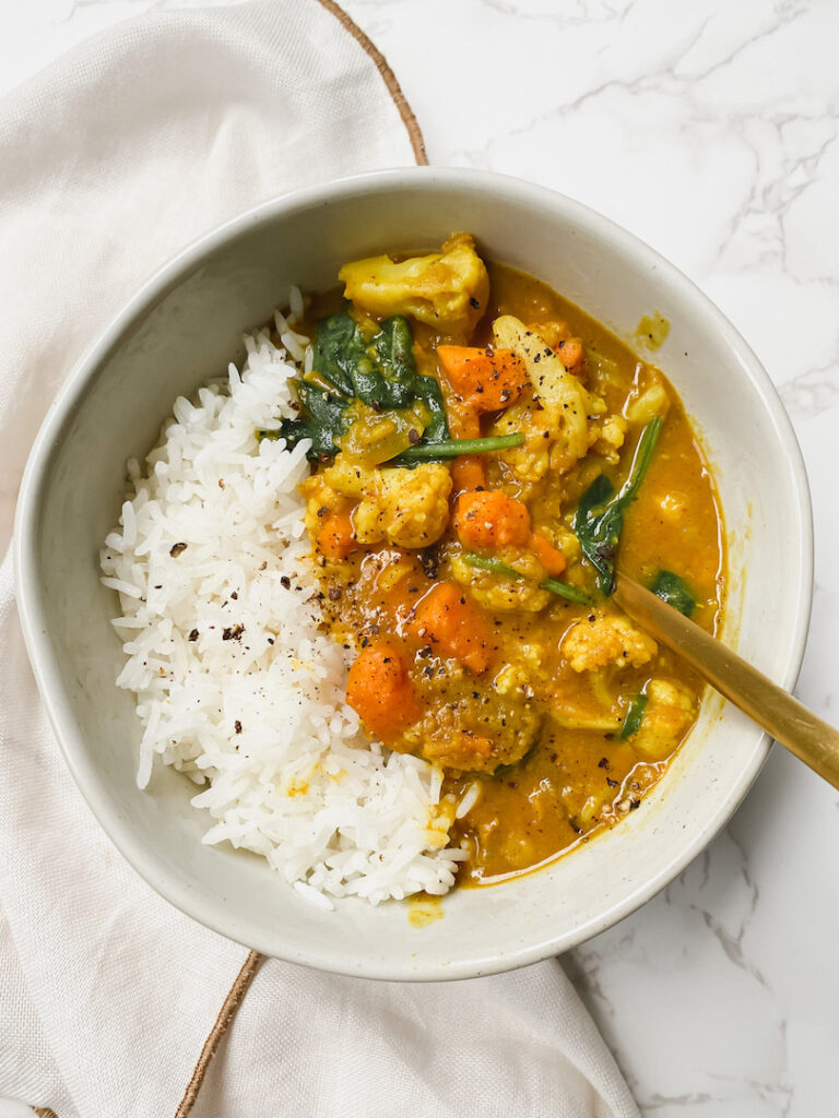 top overshot view of cauliflower sweet potato lentil curry