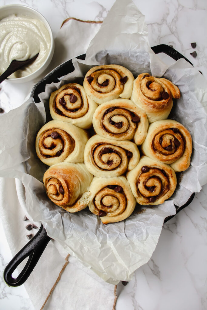 overview shot of unfrosted vegan chocolate chip cinnamon rolls