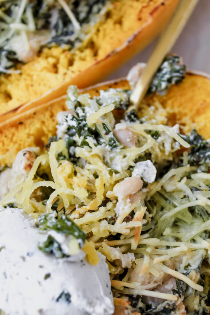 close up of a bite of spaghetti squash on a fork