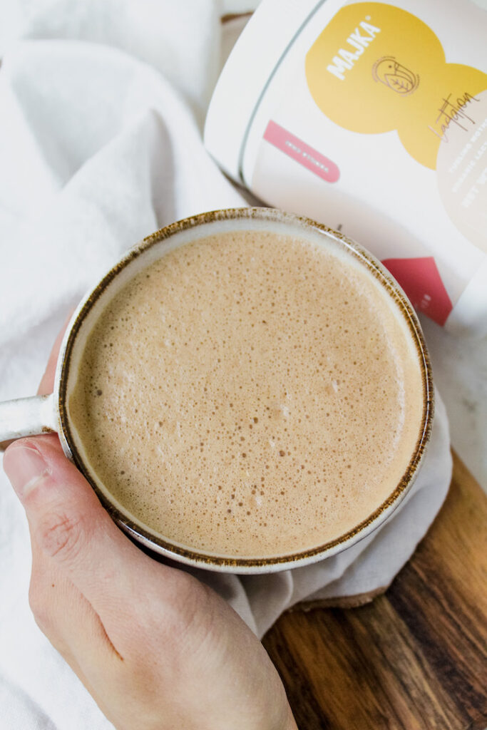 hand holding mug of hot chocolate