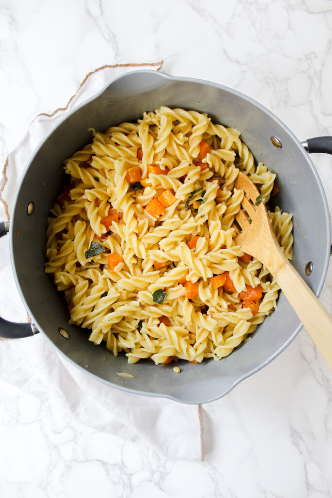 pot of vegan brown butter sage pasta with roasted butternut squash