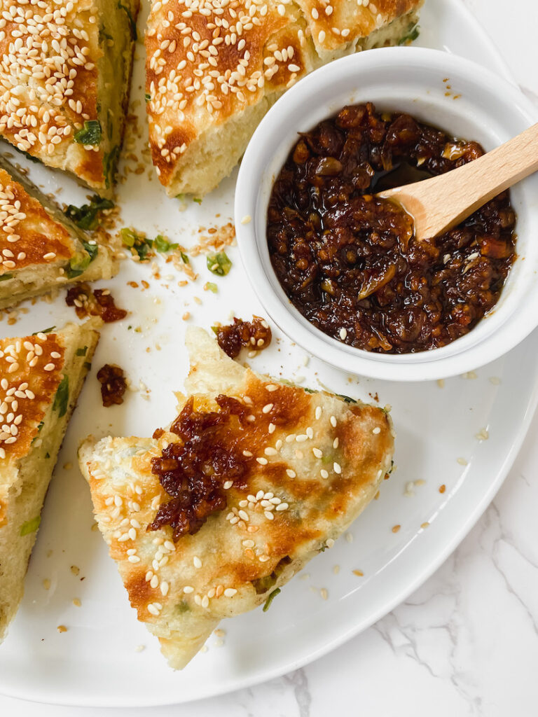 shot of scallion bread with XO sauce on top