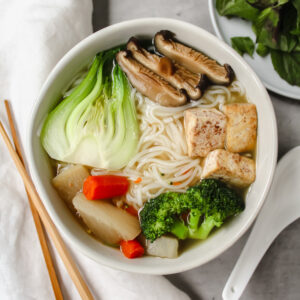 bowl of homemade vegan pho with all the topings