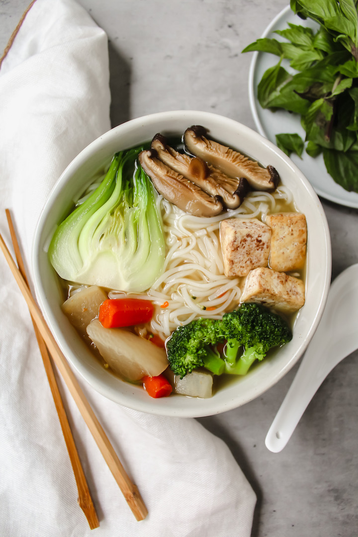 bowl of homemade vegan pho with all the topings