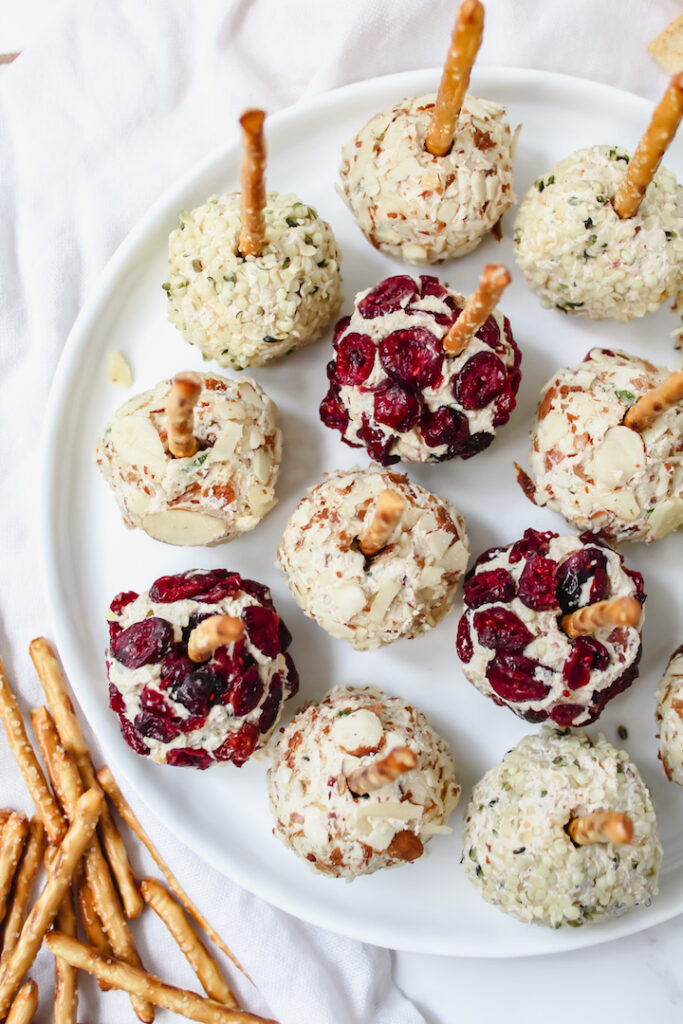 top view shot of cheese ball bites with pretzels on the side