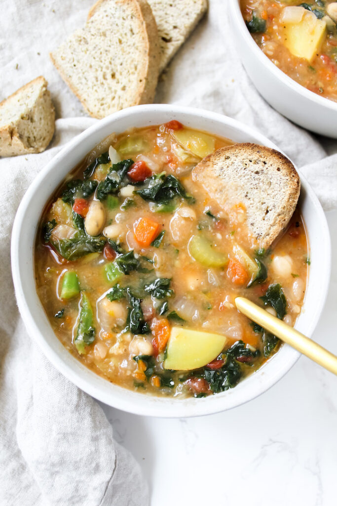 overview shot of bowl of soup with bread in it