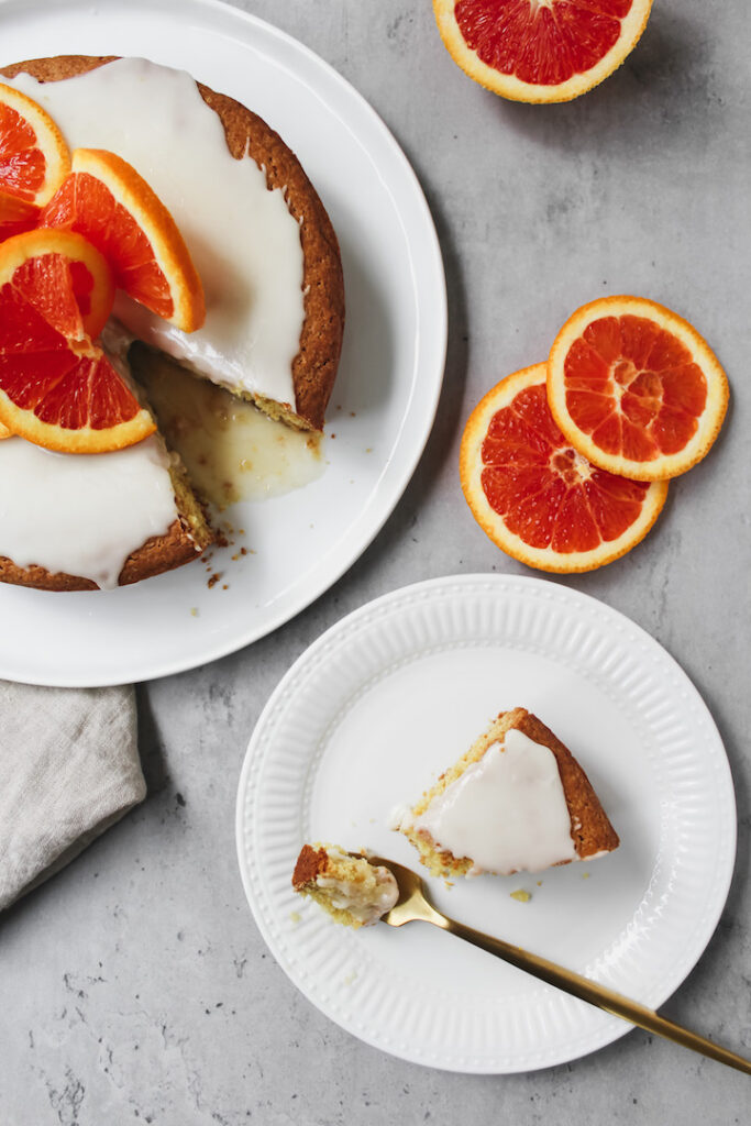 overview shot of cake and a slice on a plate