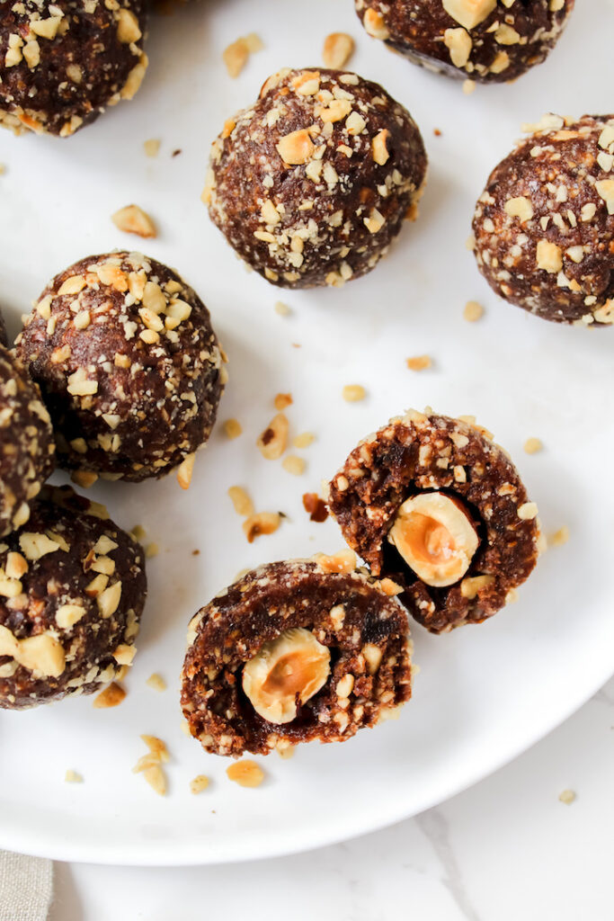 photo of a ferrero rocher ball cut in half and other whole balls 