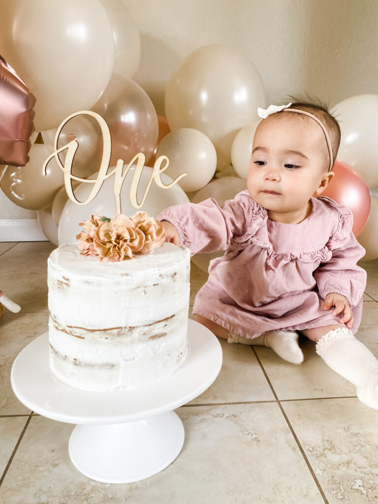 Sophie reaching for the cake