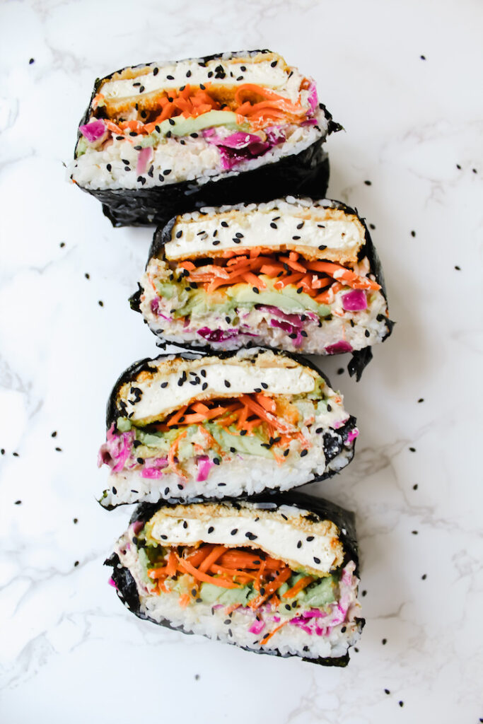 overview shot of sushi sandwiches cut in half and stacked