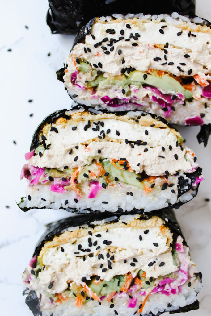 close up of vegan sushi sandwich cut in half showing all the layers