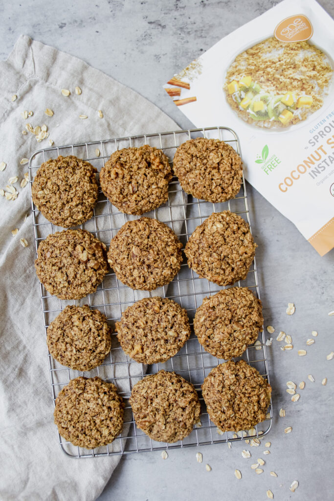 overview shot of chai spiced oatmeal cookies on a cooling rack with a bag of oats on the side