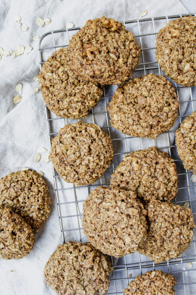 oatmeal cookies on top of a cooling rack and some on a towel