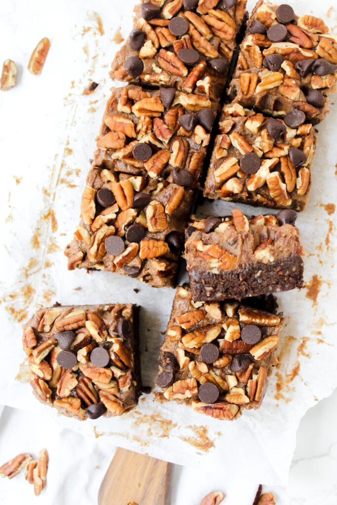 overview shot of turtle brownies with one slice on it's side