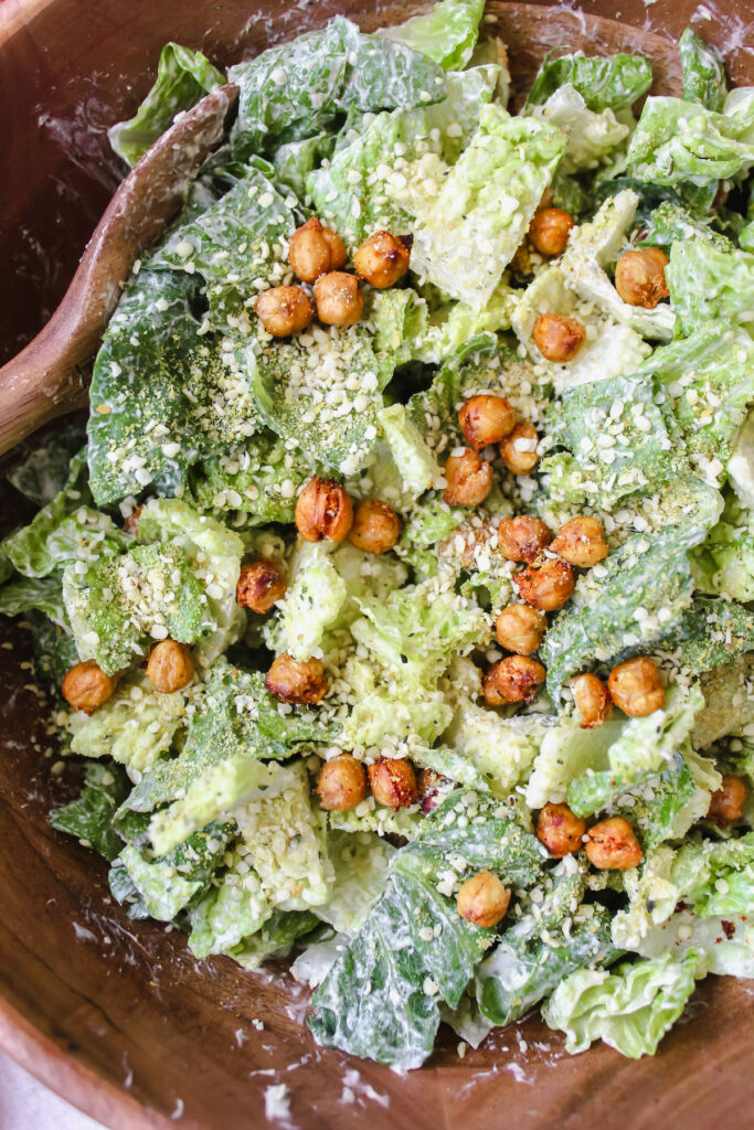 close up shot of vegan caesar salad with hemp parmesan and crispy chickpeas