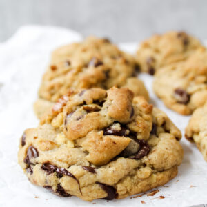 side angle shot of a row of chocolate chip cookies