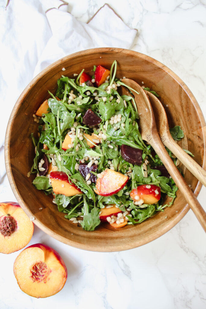 overview shot of peach beet couscous salad