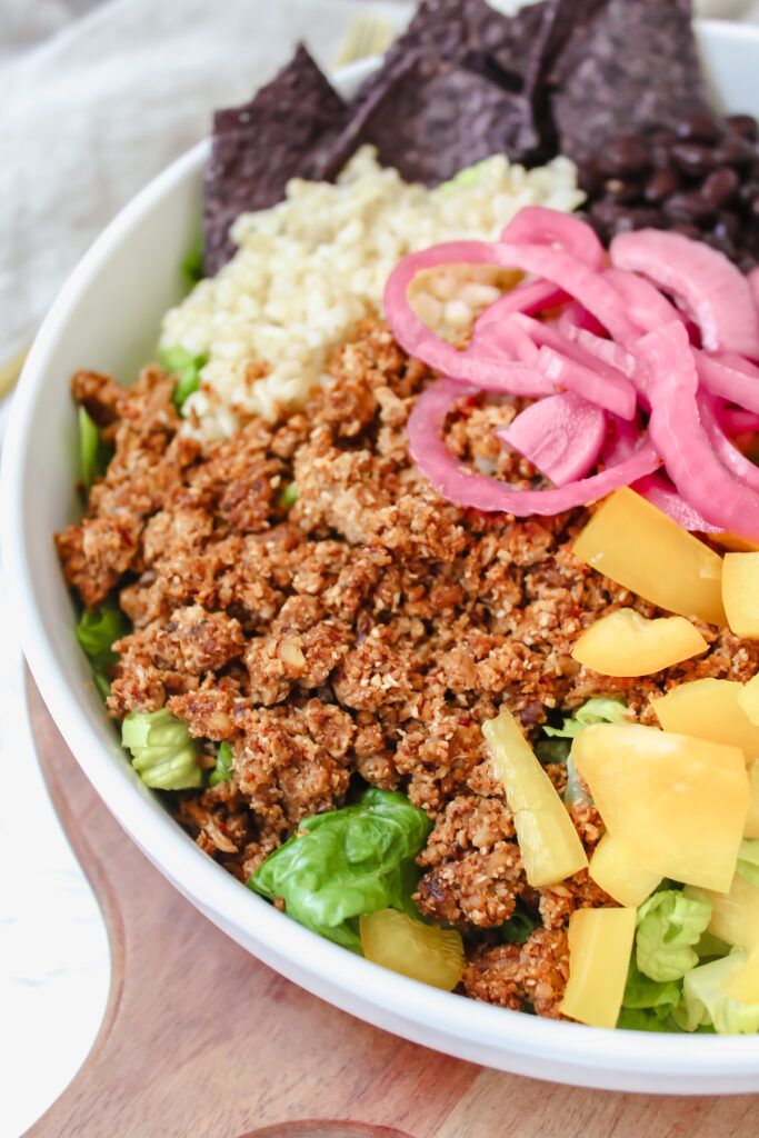 angled shot of the cauliflower walnut taco meat in the taco salad