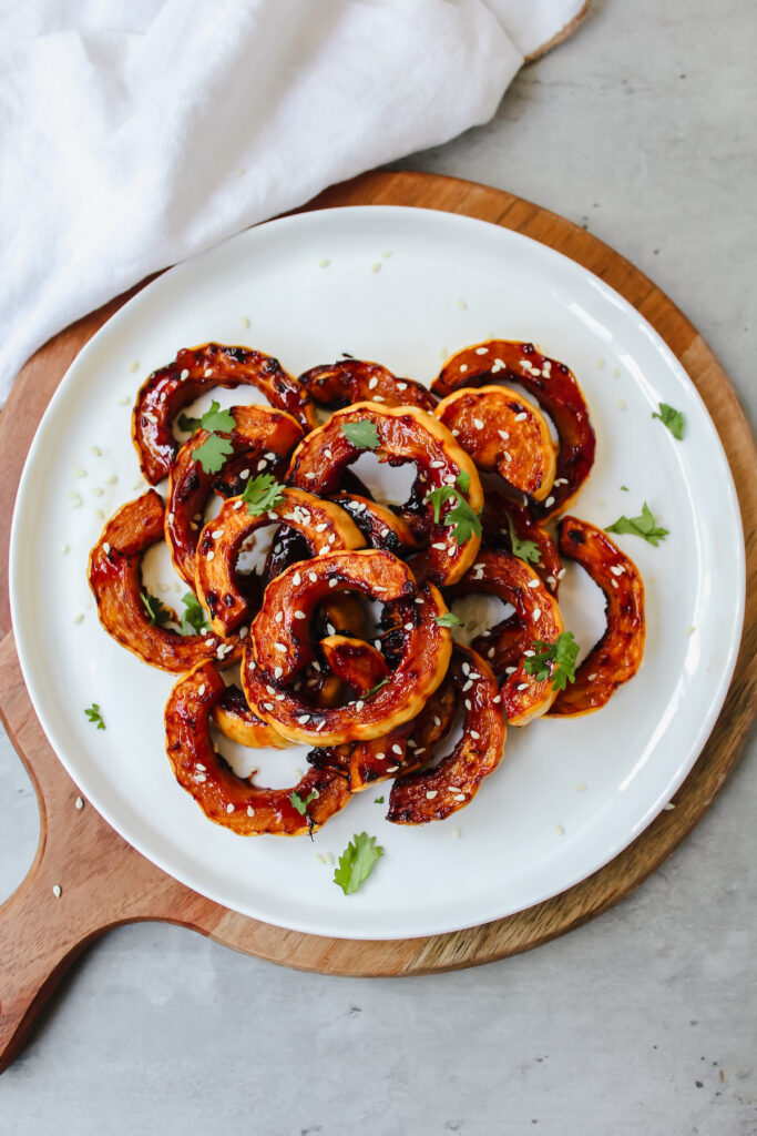 overview shot of entire plate of maple gochujang roasted delicata squash