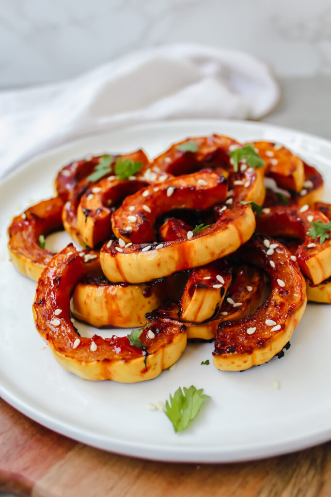 side view of delicata stacked on top of each other