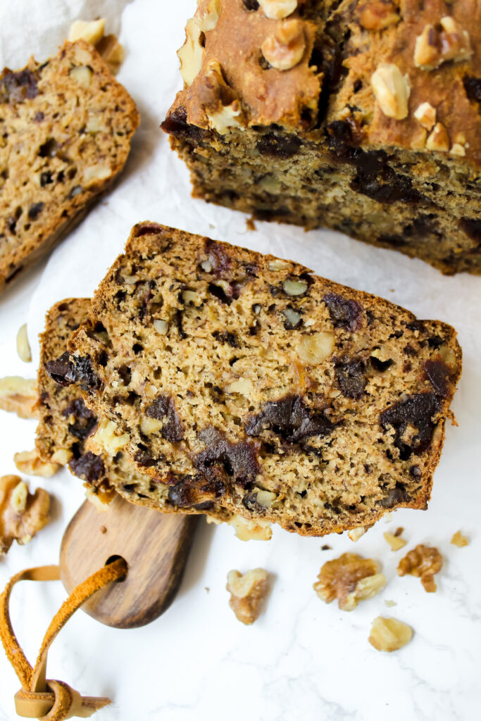 overview close up shot of a slice of banana date nut bread