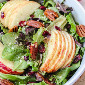 3/4 of the apple cinnamon salad shown in the bowl