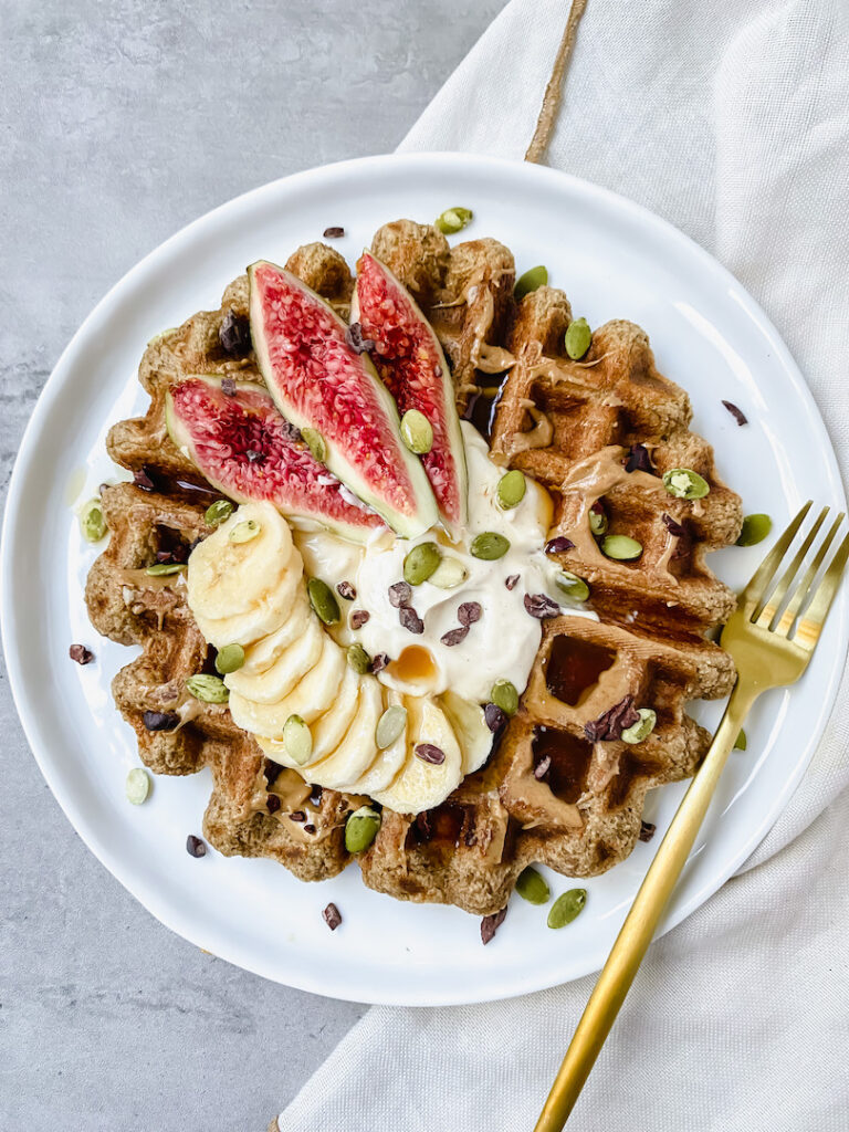 overview of banana oat blender waffle with maple syrup