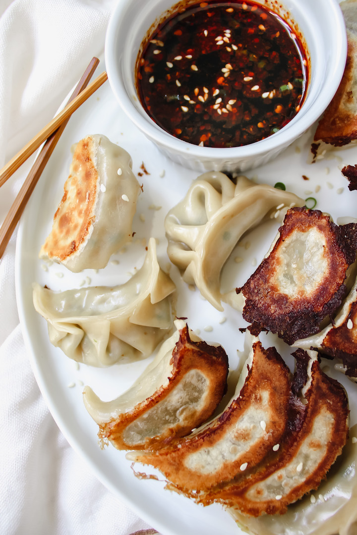 photo of potstickers and soy sauce