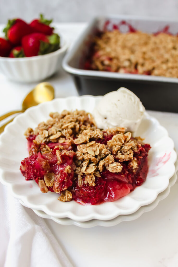 angled shot of a plate with strawberry crisp on top
